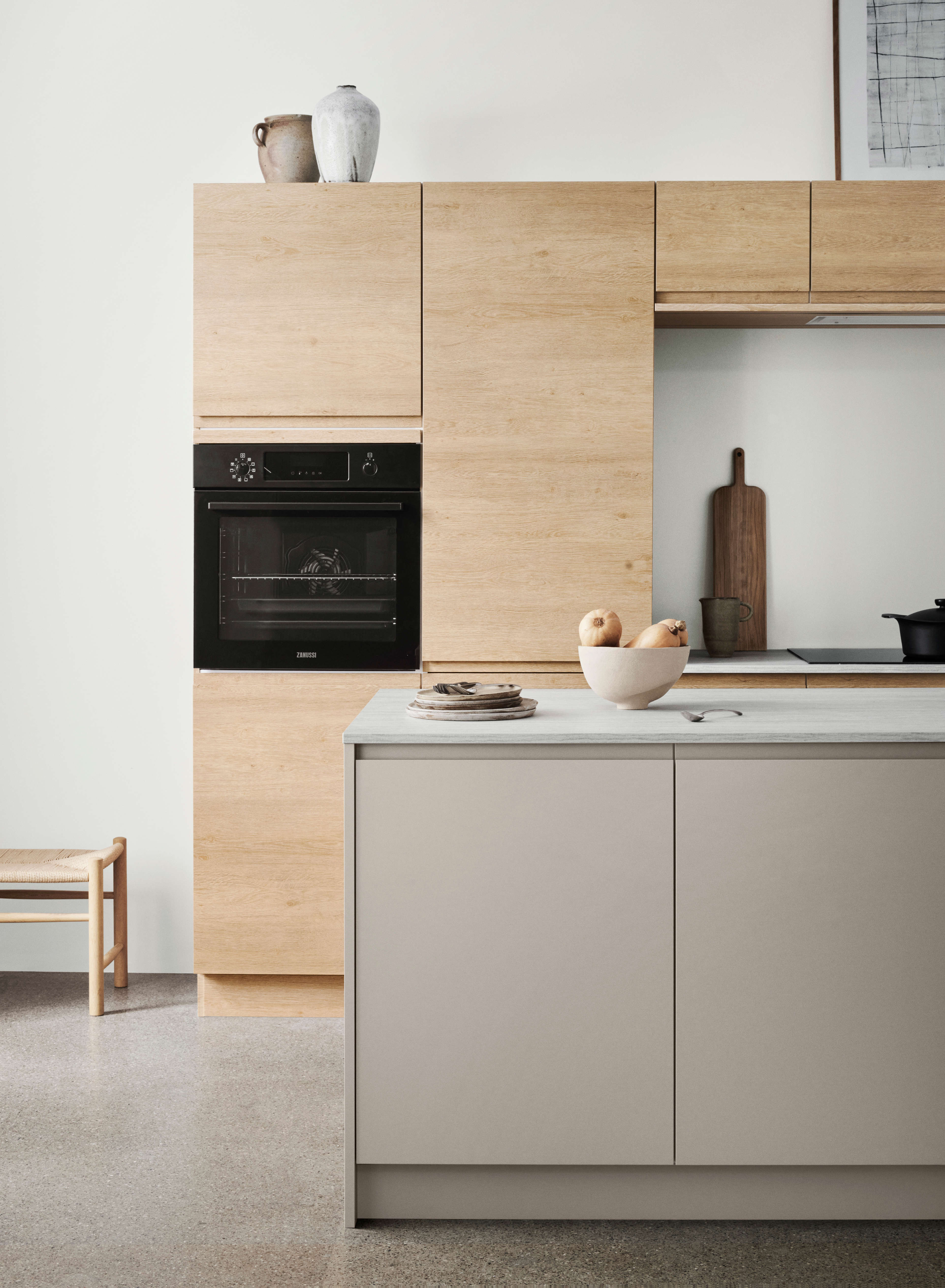 NOLIAM arizona beige kitchen cabinets and island with minimalist Nordic design, featuring sleek wooden panels for a modern, organized space.