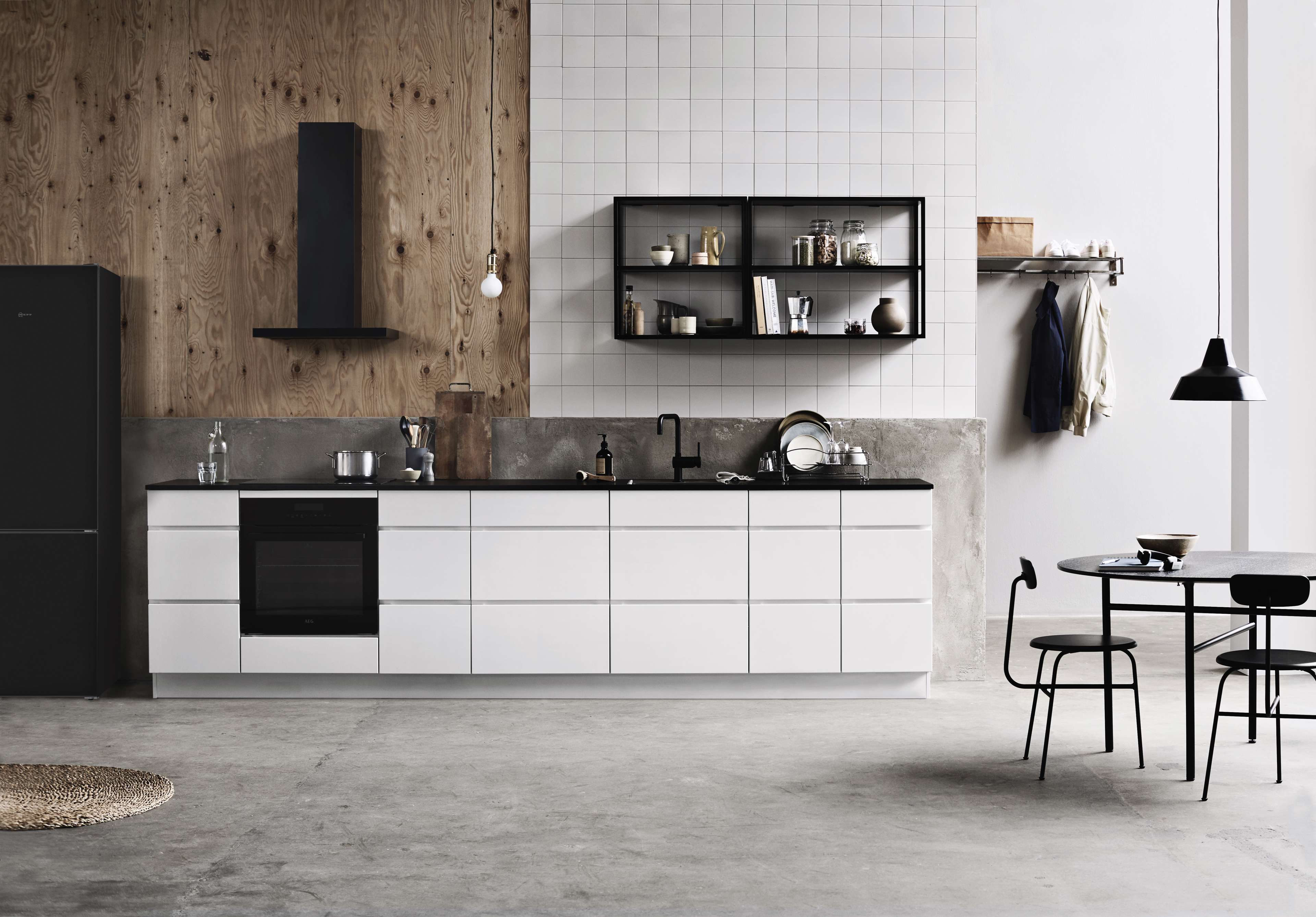 White rustic kitchen with built-in oven and white fronts