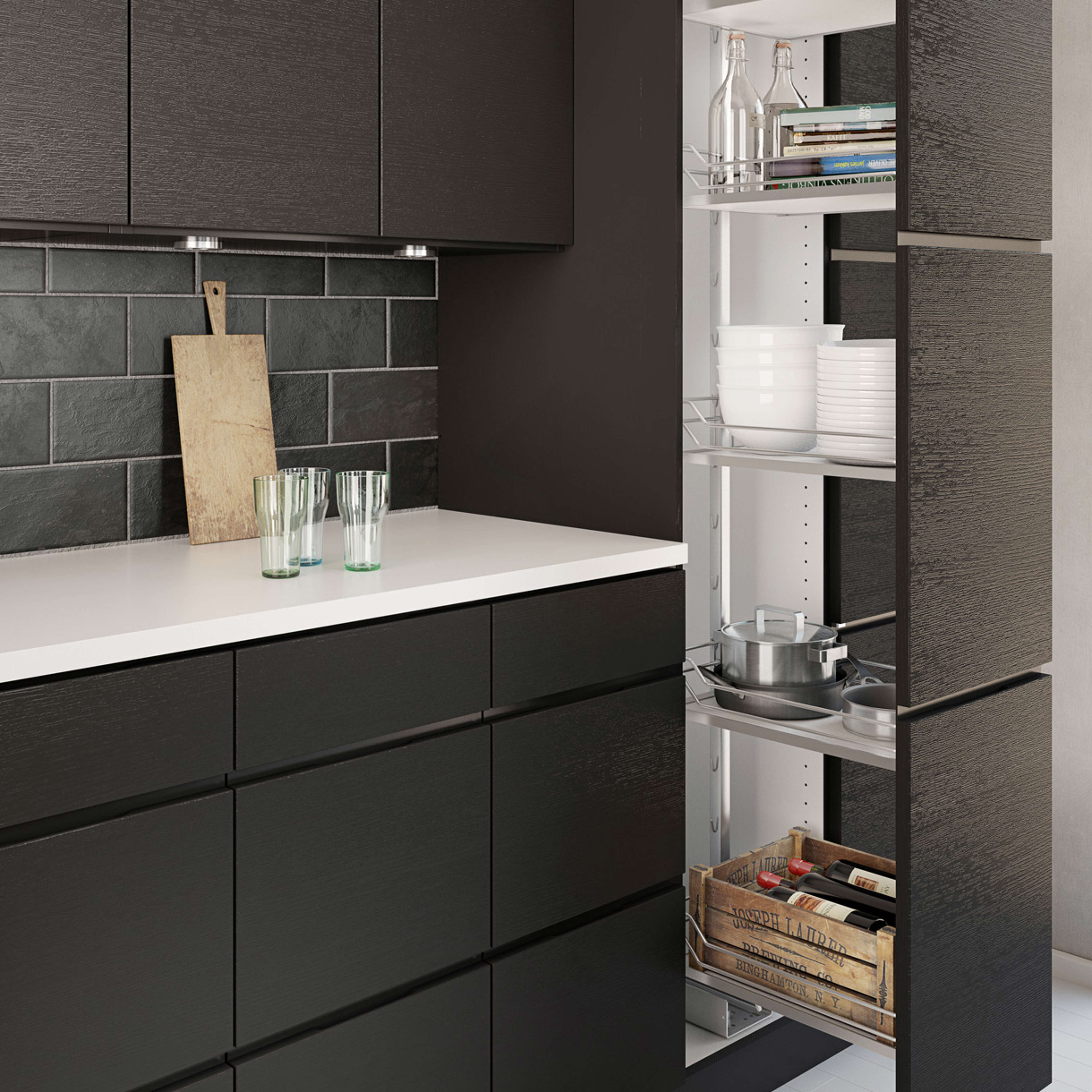 MANO sera kitchen with matte black cabinets and sleek white countertop, creating a modern, minimalist Nordic style with hidden storage solutions.