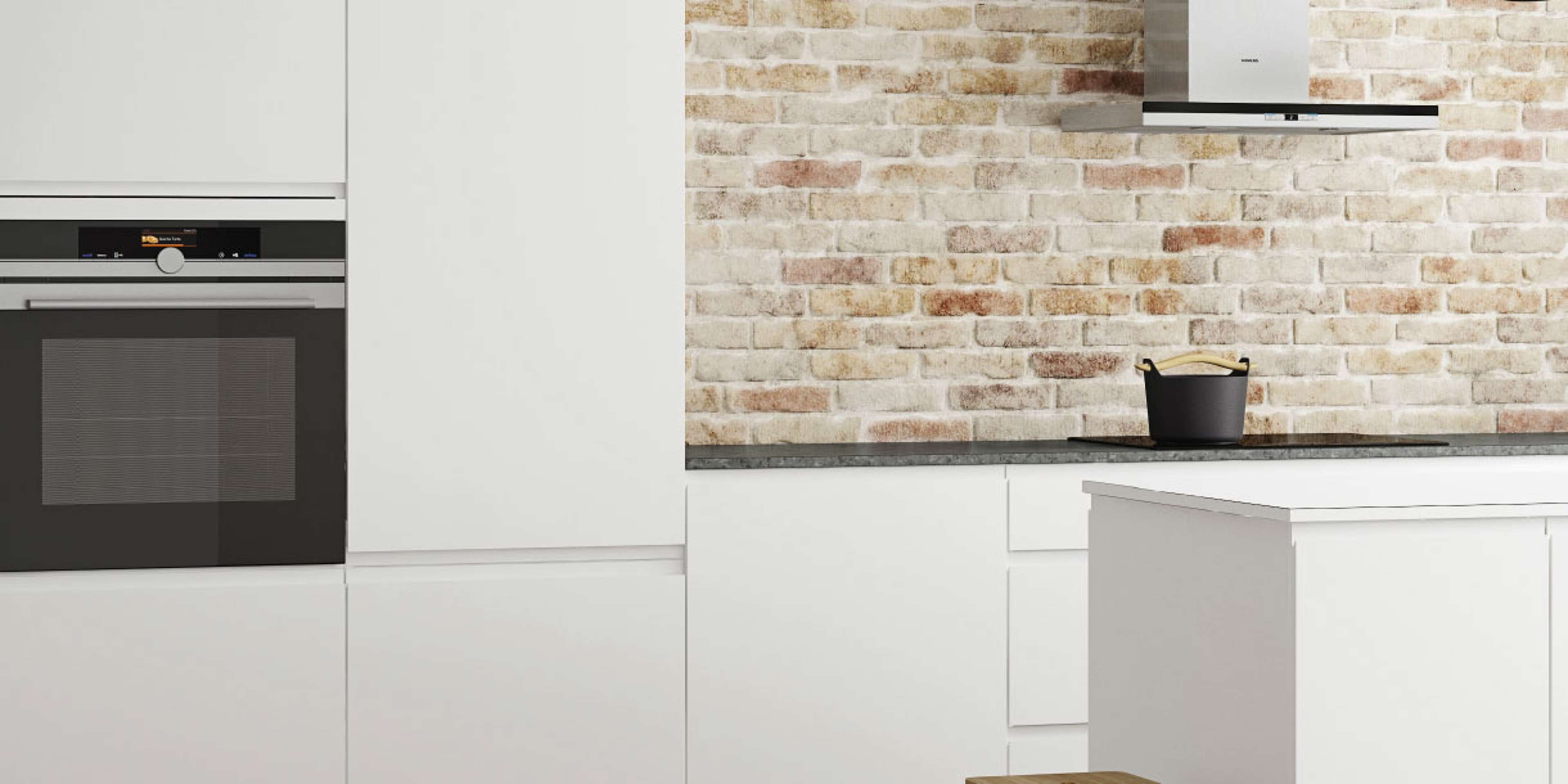 NOLIAM hvide køkkenskabe med minimalistisk design, slanke overflader og integrerede hvidevarer, der skaber et moderne og indbydende kulinarisk rum.