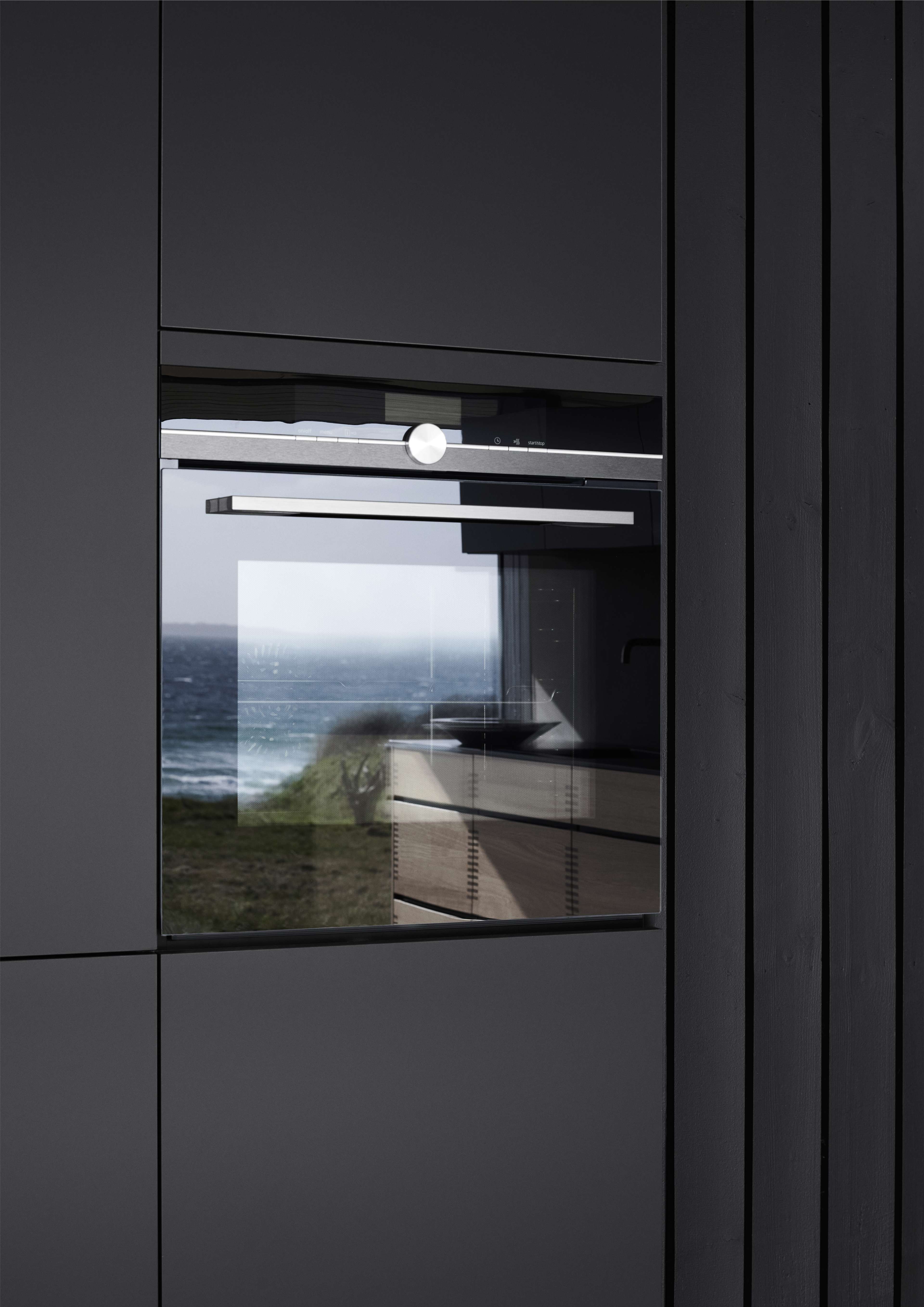 OAKWOOD wood kitchen cabinet with sleek, modern design featuring a reflective glass panel, integrating style and functionality in muted tones.