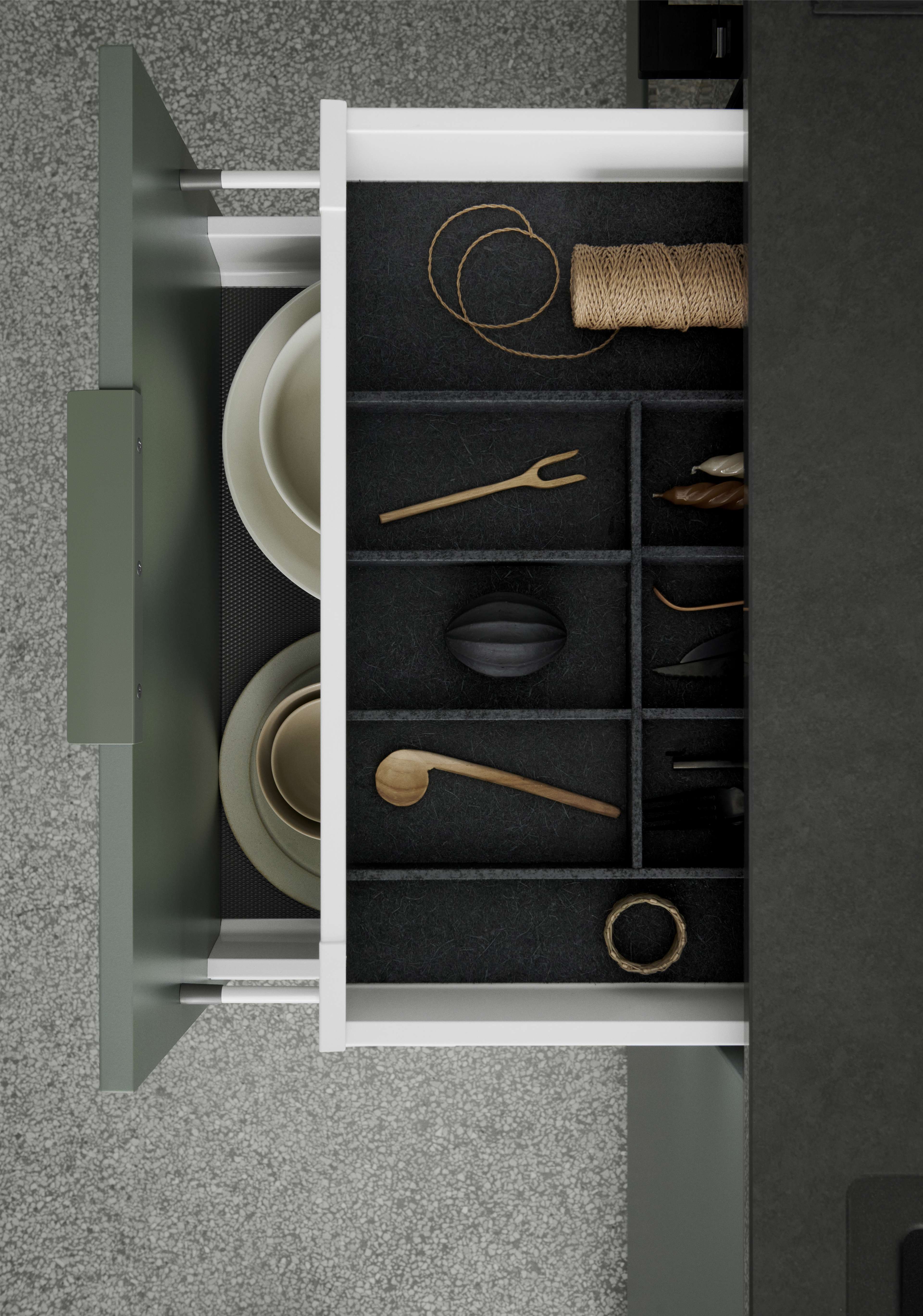 VEDA green kitchen drawer with modern design, featuring organized storage compartments and minimalist style, enhancing functional kitchen aesthetics.