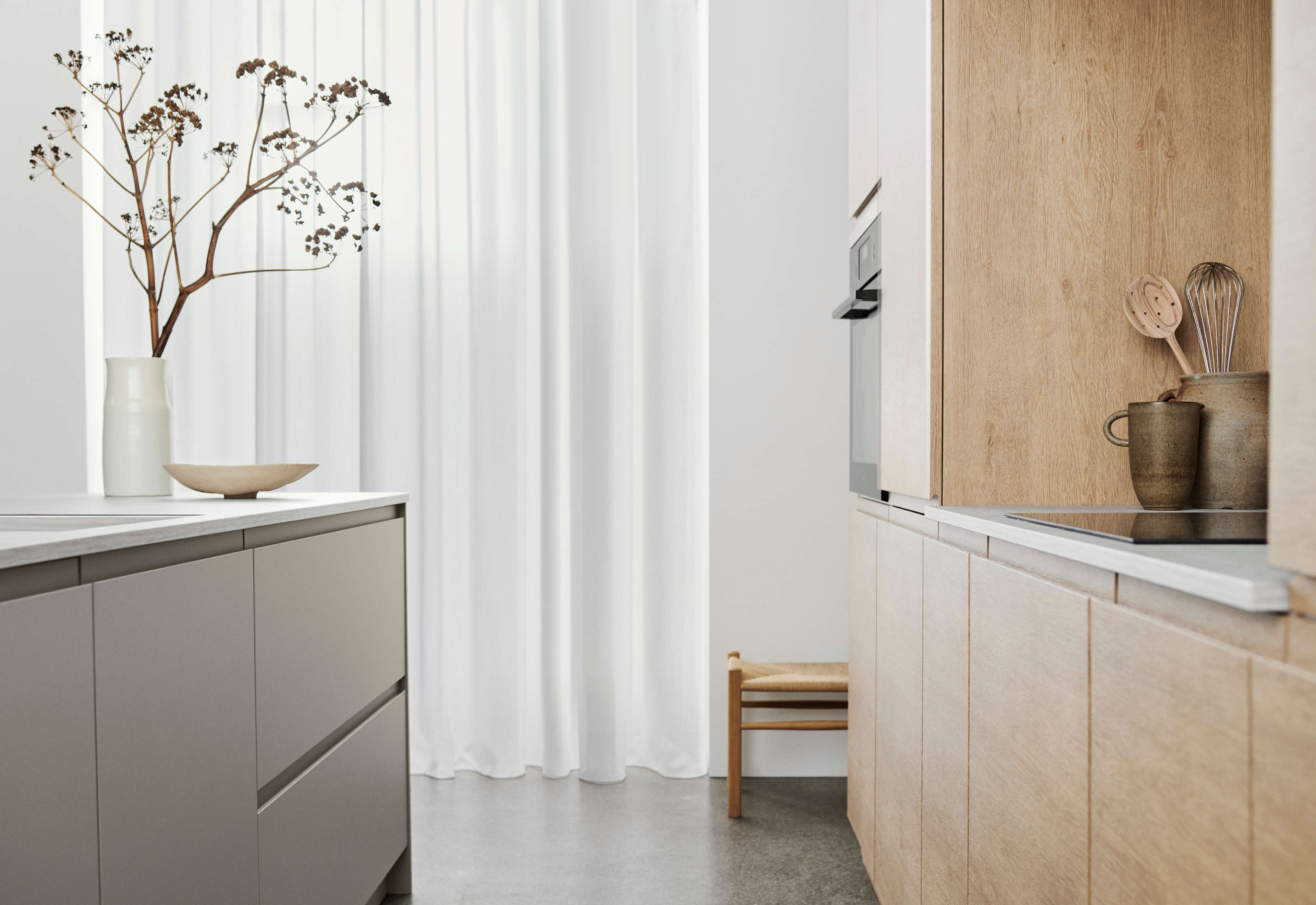 NOLIAM arizona beige kitchen cabinetry with sleek minimalist design, featuring soft-close drawers and elegant wood accents for a modern aesthetic.
