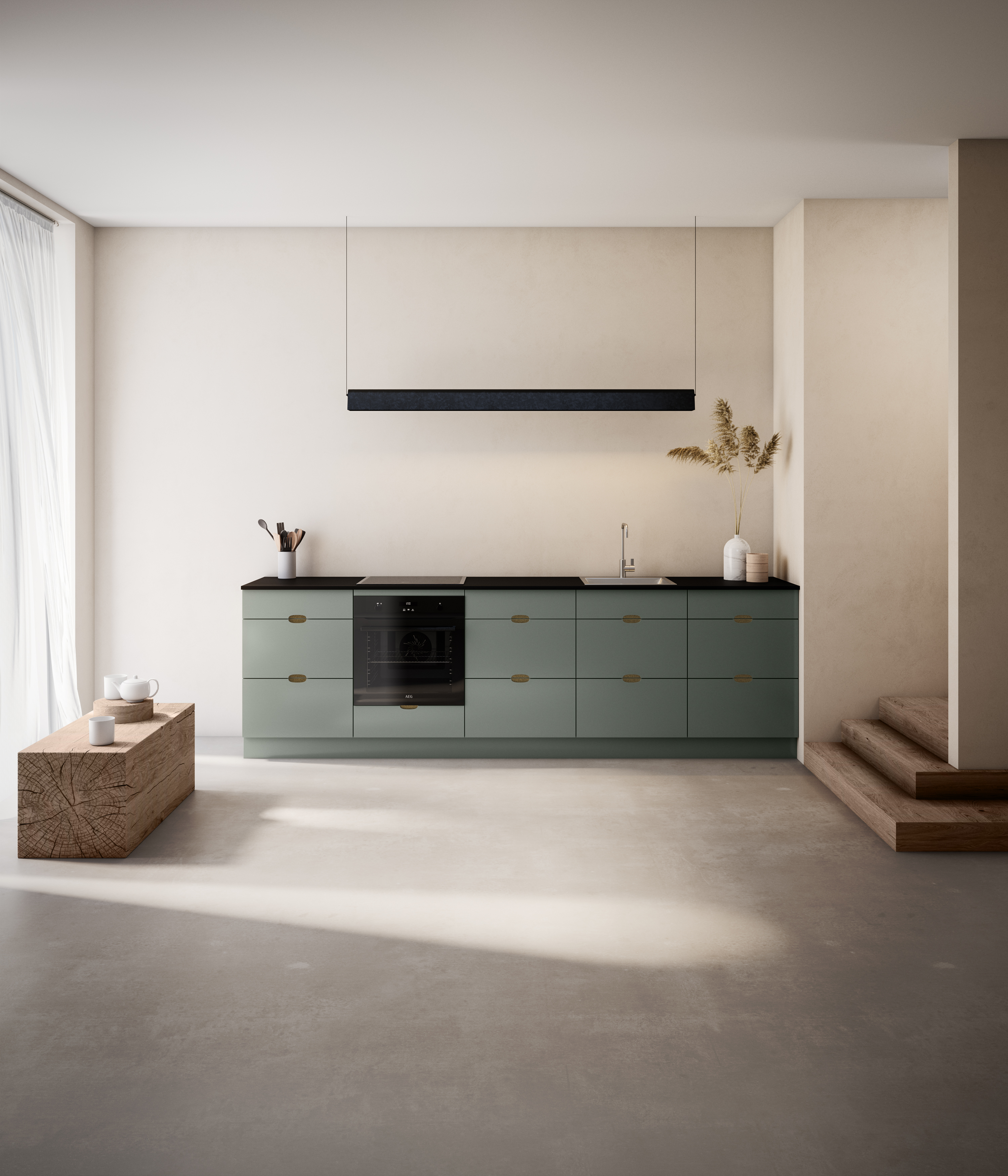 Green kitchen with brass handles