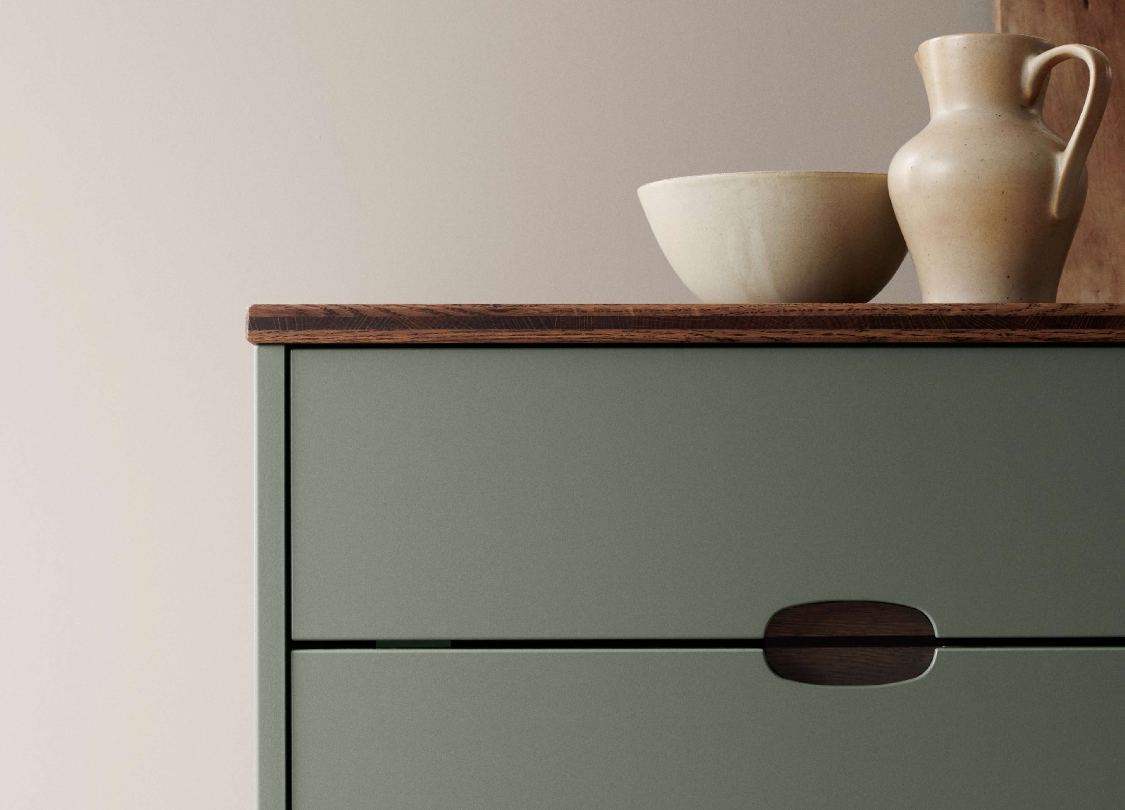 Green kitchen with a wooden worktop