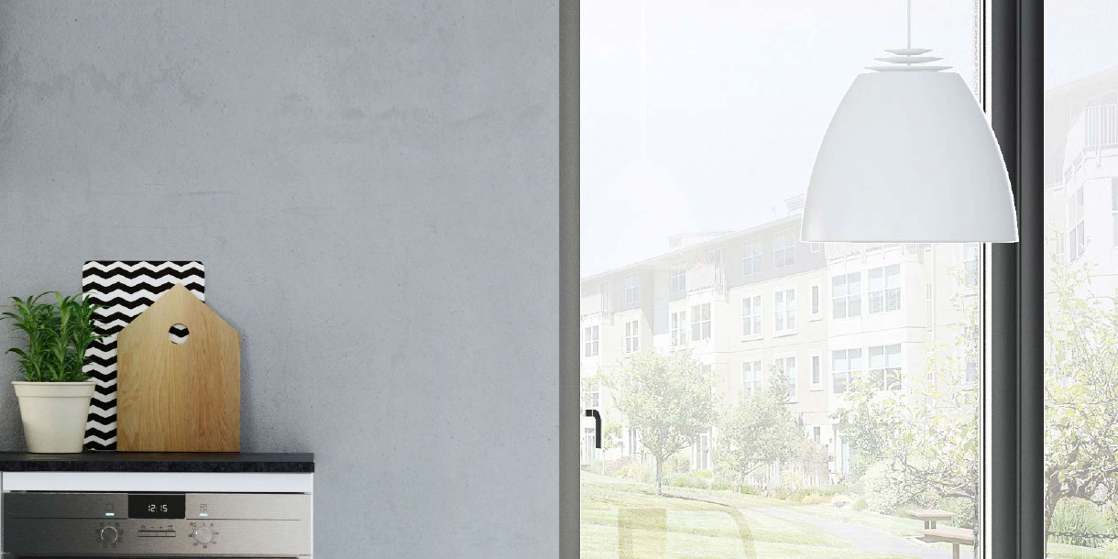 MILK hvitt kjøkken med elegante skap med minimalistisk design, supplert med en glatt grå vegg, som skaper et moderne og luftig rom.
