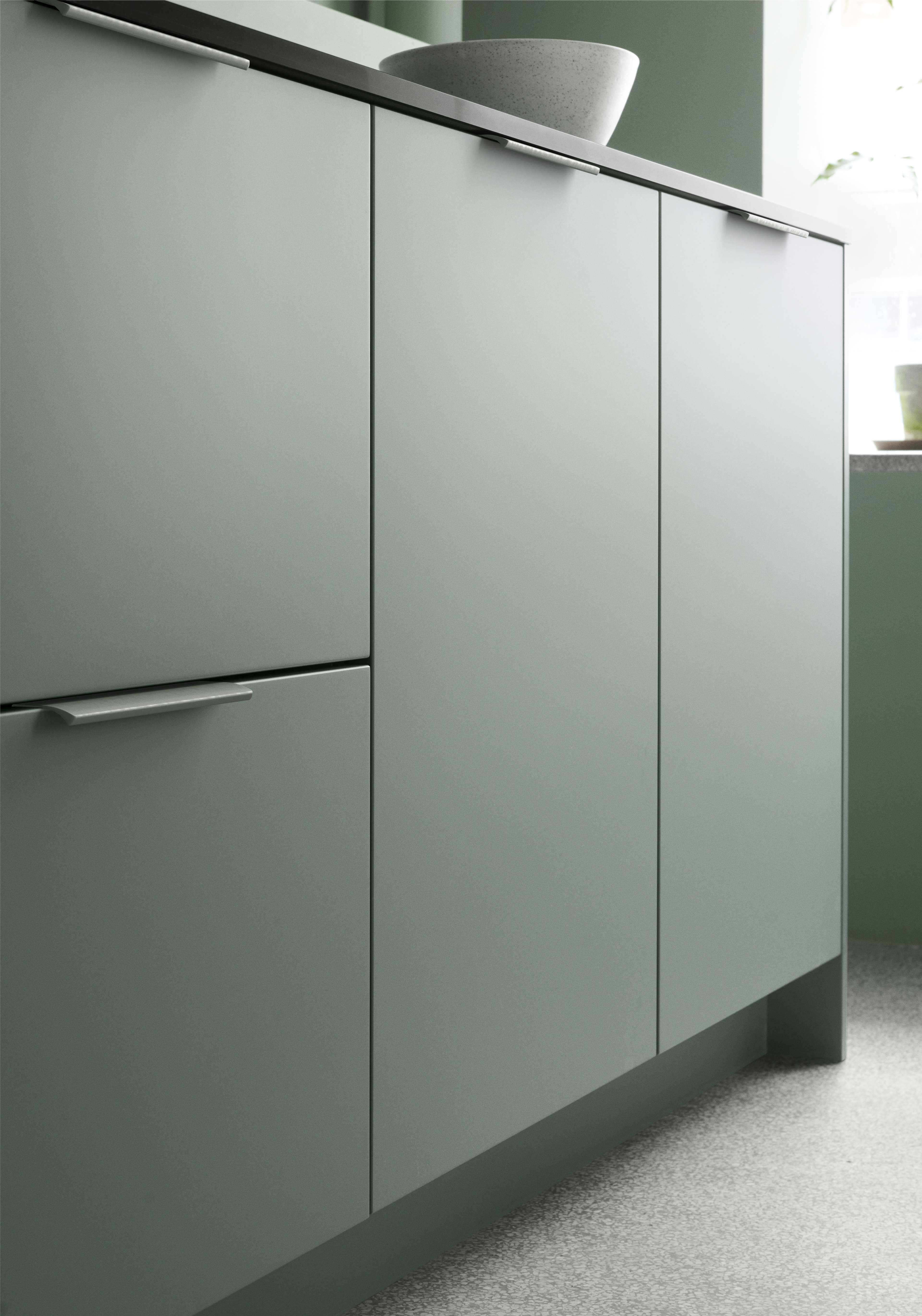 VEDA green kitchen cabinet with sleek, modern design featuring matte finish and minimalist handles, perfect for an elegant and contemporary space.