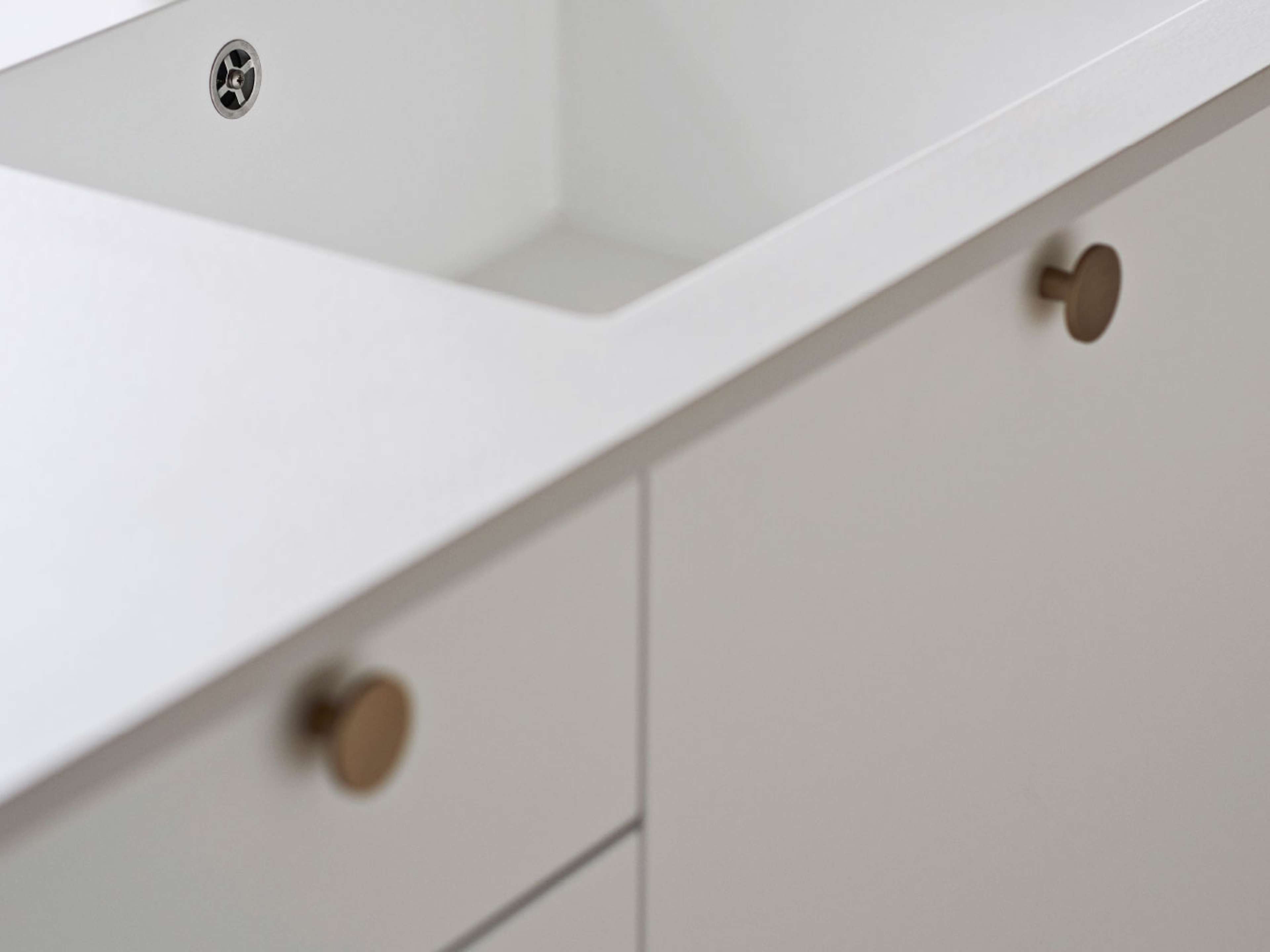 White kitchen with cabinets and dot handles