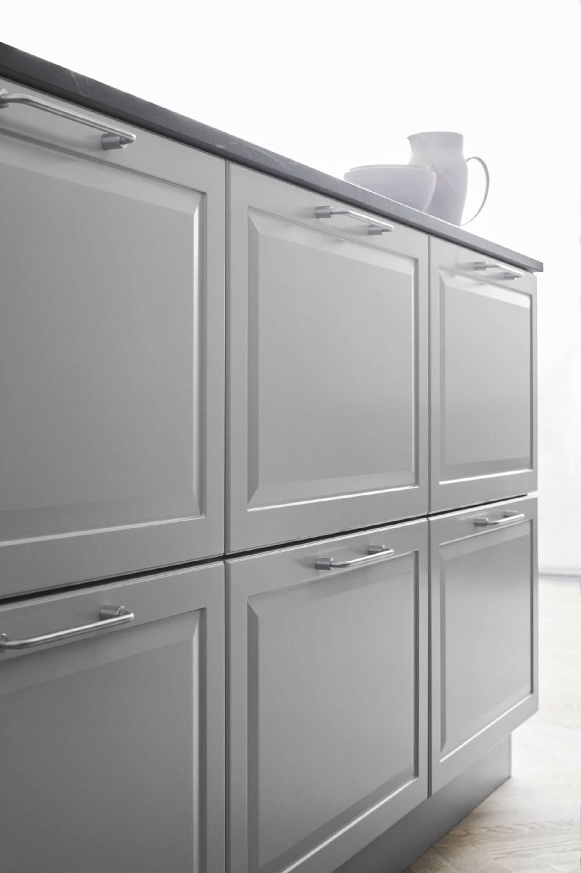 PAVIA pure grey kitchen cabinet featuring sleek modern design with matte finish, clean lines, and minimalist handles for a sophisticated look.