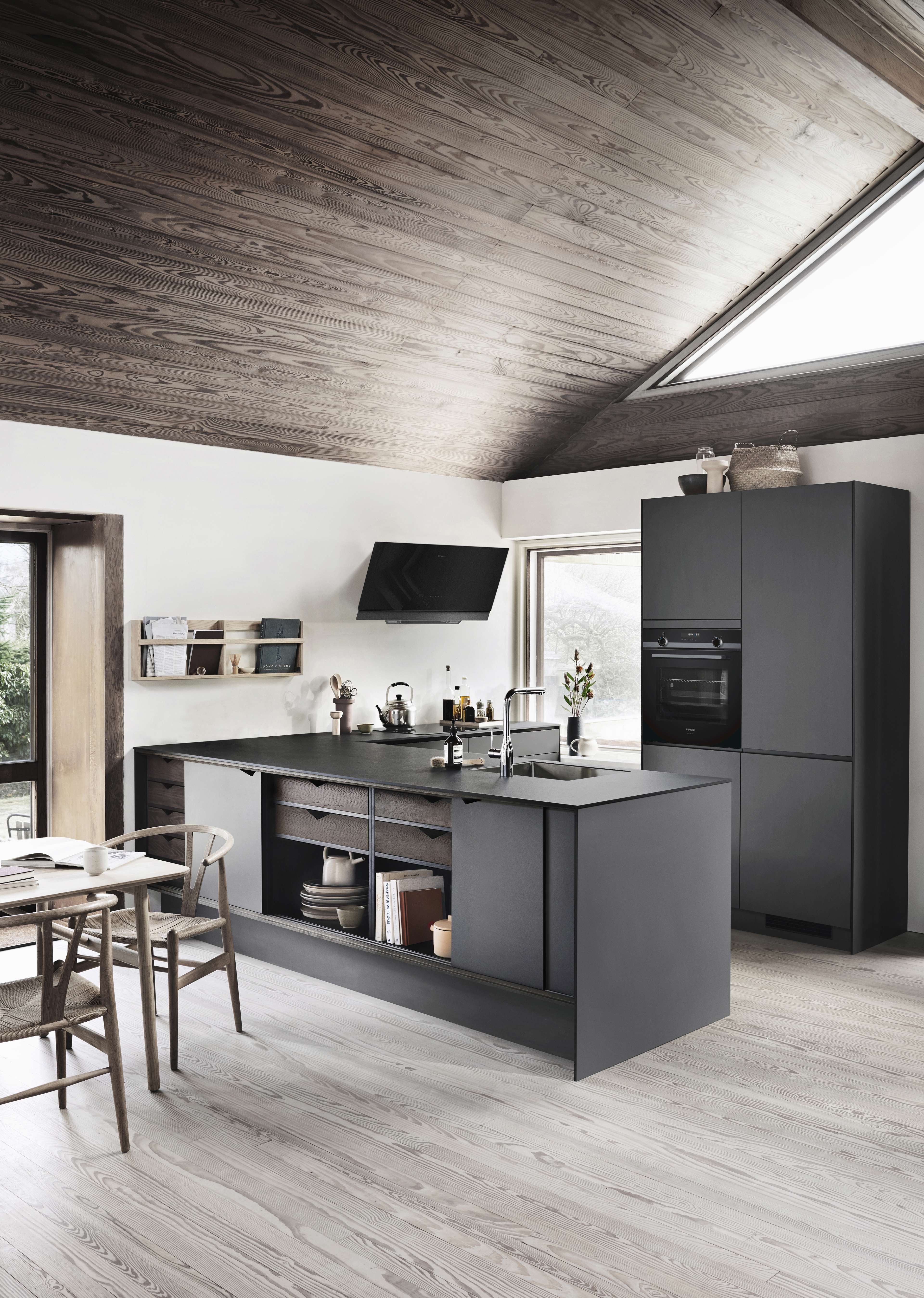 PRATO dark grey kitchen with seamless matt finish, minimalist design, and ample storage, embodying modern elegance and function in a sleek space.