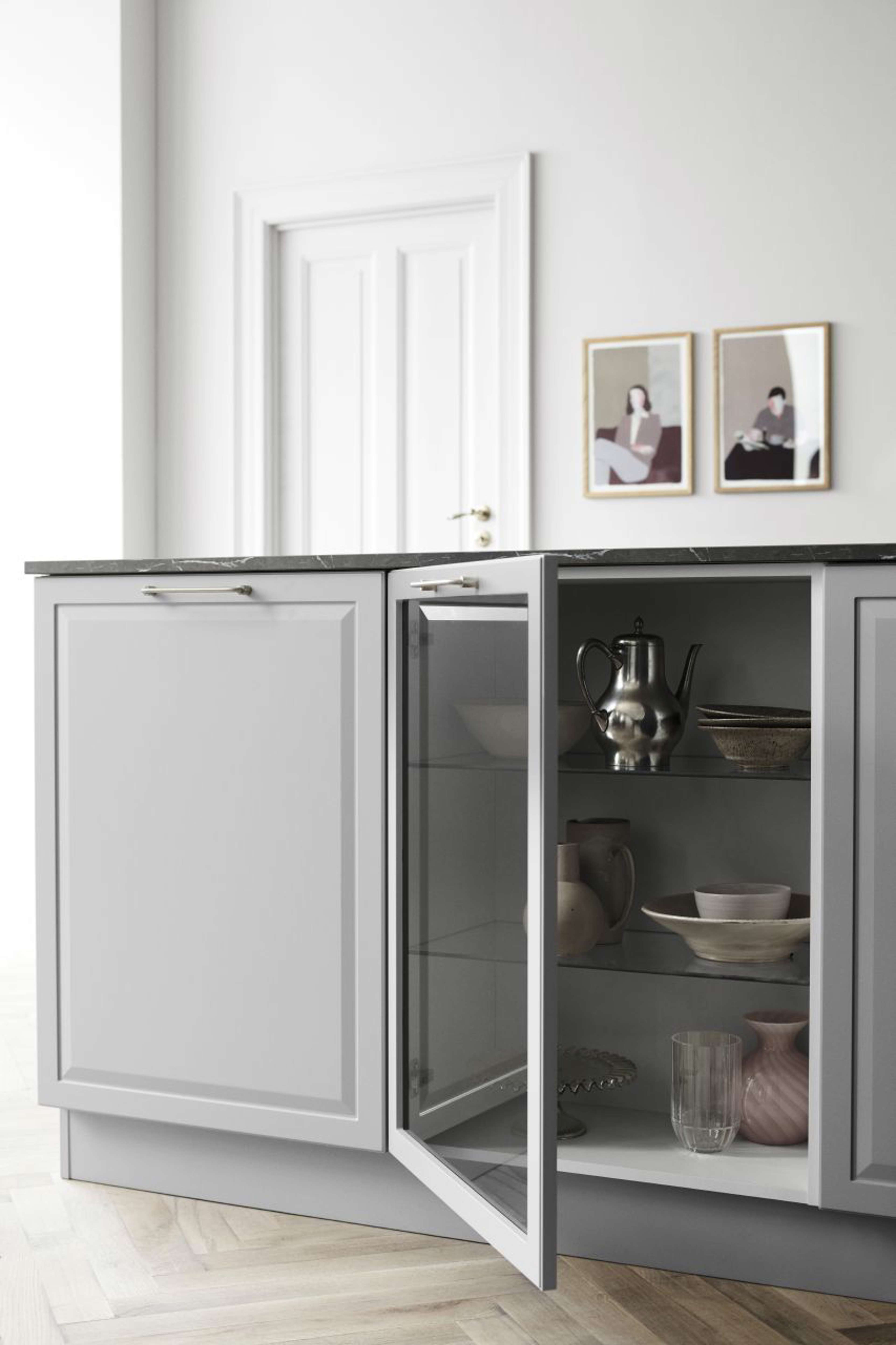 PAVIA pure grey kitchen cabinets with sleek, modern design and glass-front doors, creating a stylish and functional space for a contemporary home.