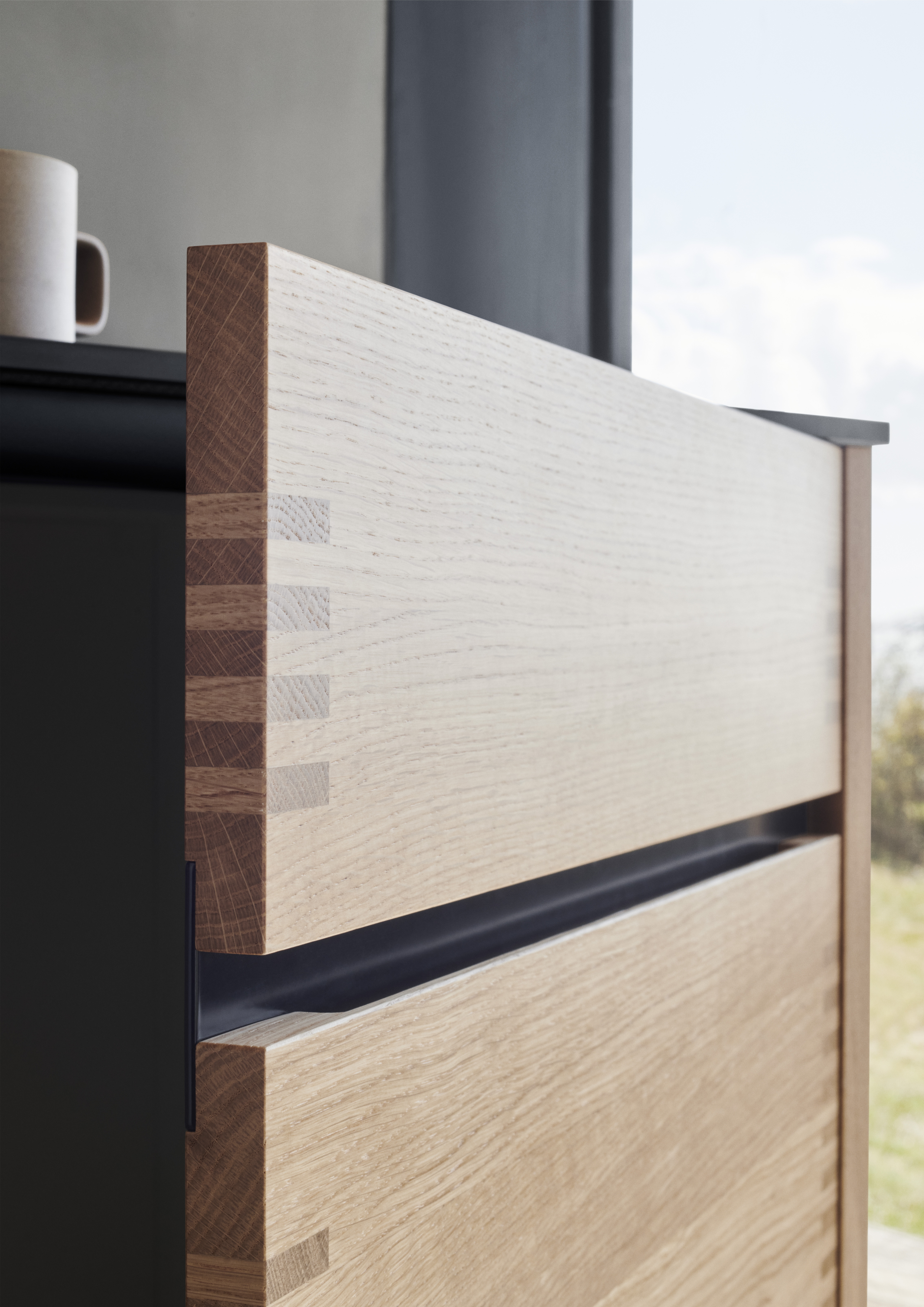 OAKWOOD wood kitchen cabinet with sleek dovetail joints, showcasing a modern yet warm natural finish, ideal for contemporary interior design.